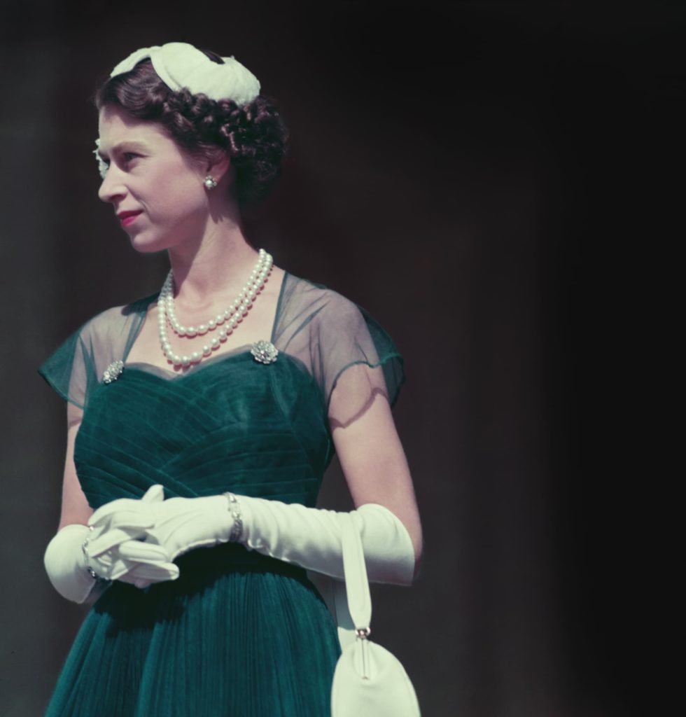 Queen Elizabeth II on the balcony of Government House, Melbourne, during her tour of Australia, March 1954. (Photo by Fox Photos/Hulton Archive/Getty Images)