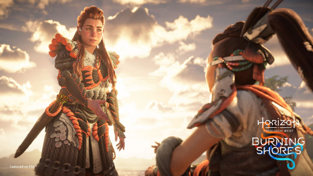 Aloy holding out her hand to help Seyka up in the Horizon Forbidden West: Burning Shores launch trailer.