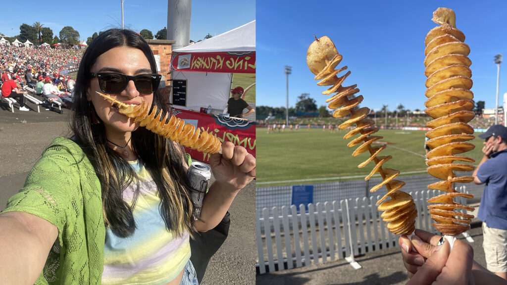 Girl eating potato tornado at AFLW game