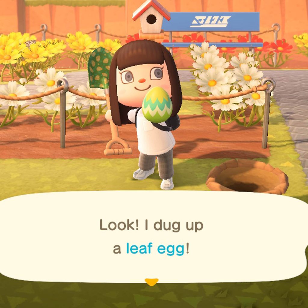 A character in Animal Crossing: New Horizons holding up a Bunny Day egg from the Bunny Day 2022 event.