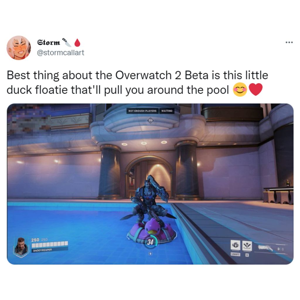 A tweet from @stormcallart that reads: "Best thing about the Overwatch 2 Beta is this little duck floatie that'll pull you around the pool" above a screenshot from the Overwatch 2 beta showing Hanzo floating on a little duck floatie.