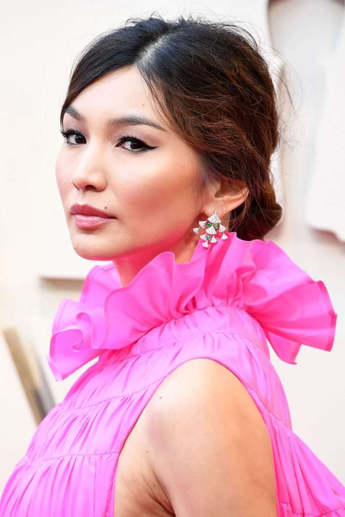 Gemma Chan wears the messy chignon