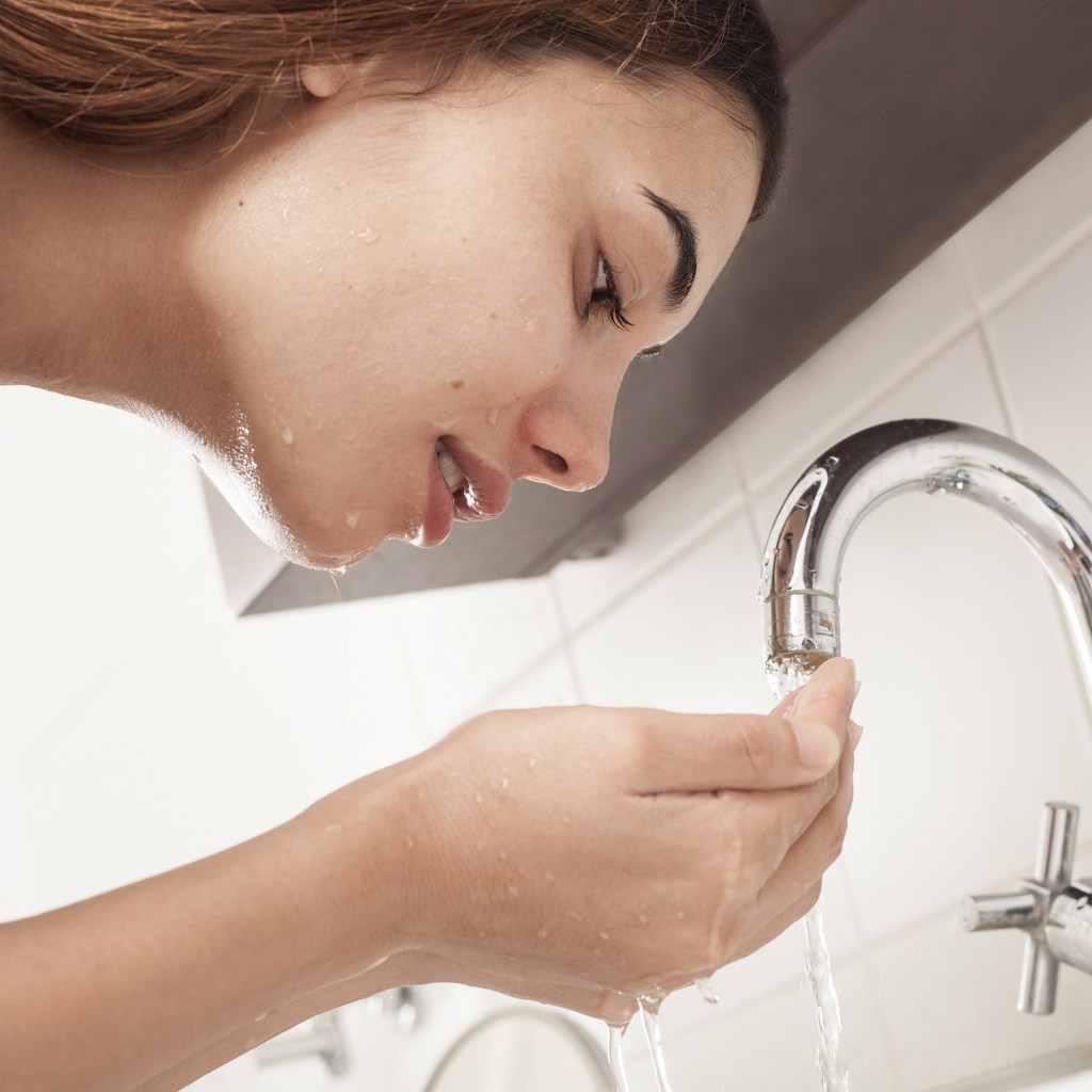 Woman washing face