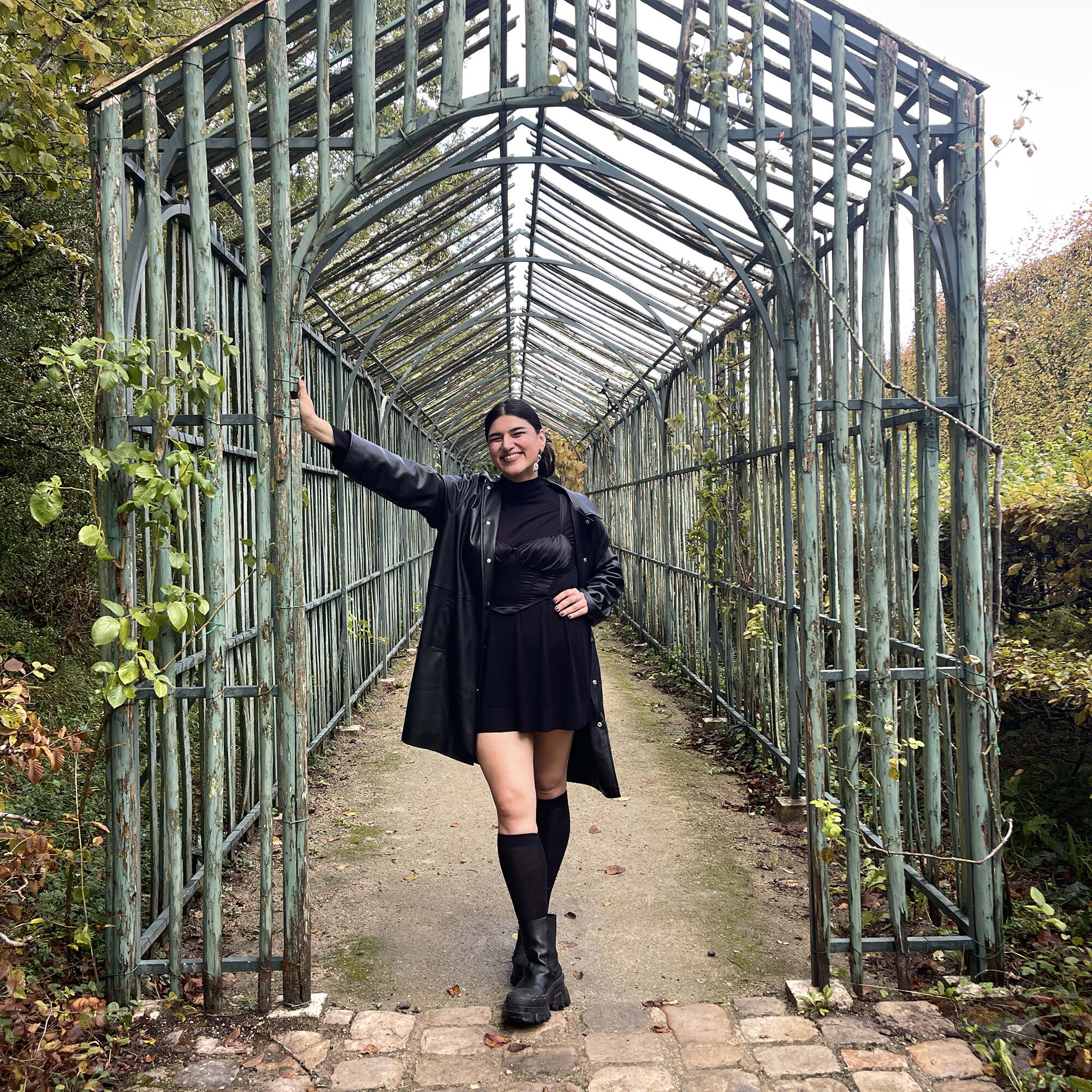 Women presenting person standing in archway